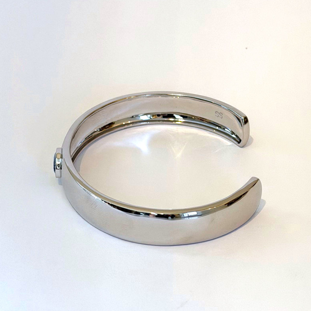 Sterling silver cuff bracelet with oval blue zircon by Scott Spurling, side view